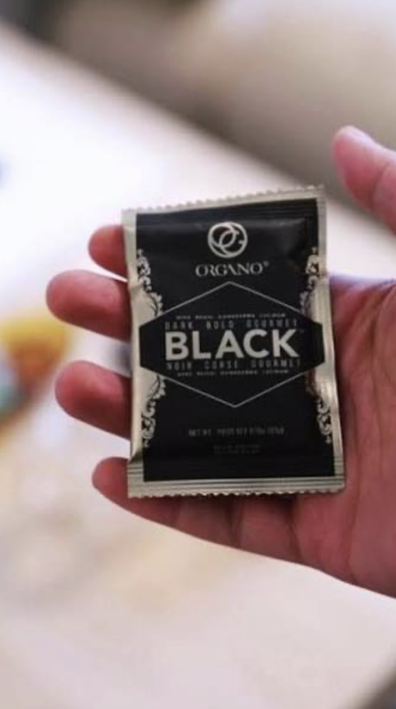 Organo Black sachet in hand