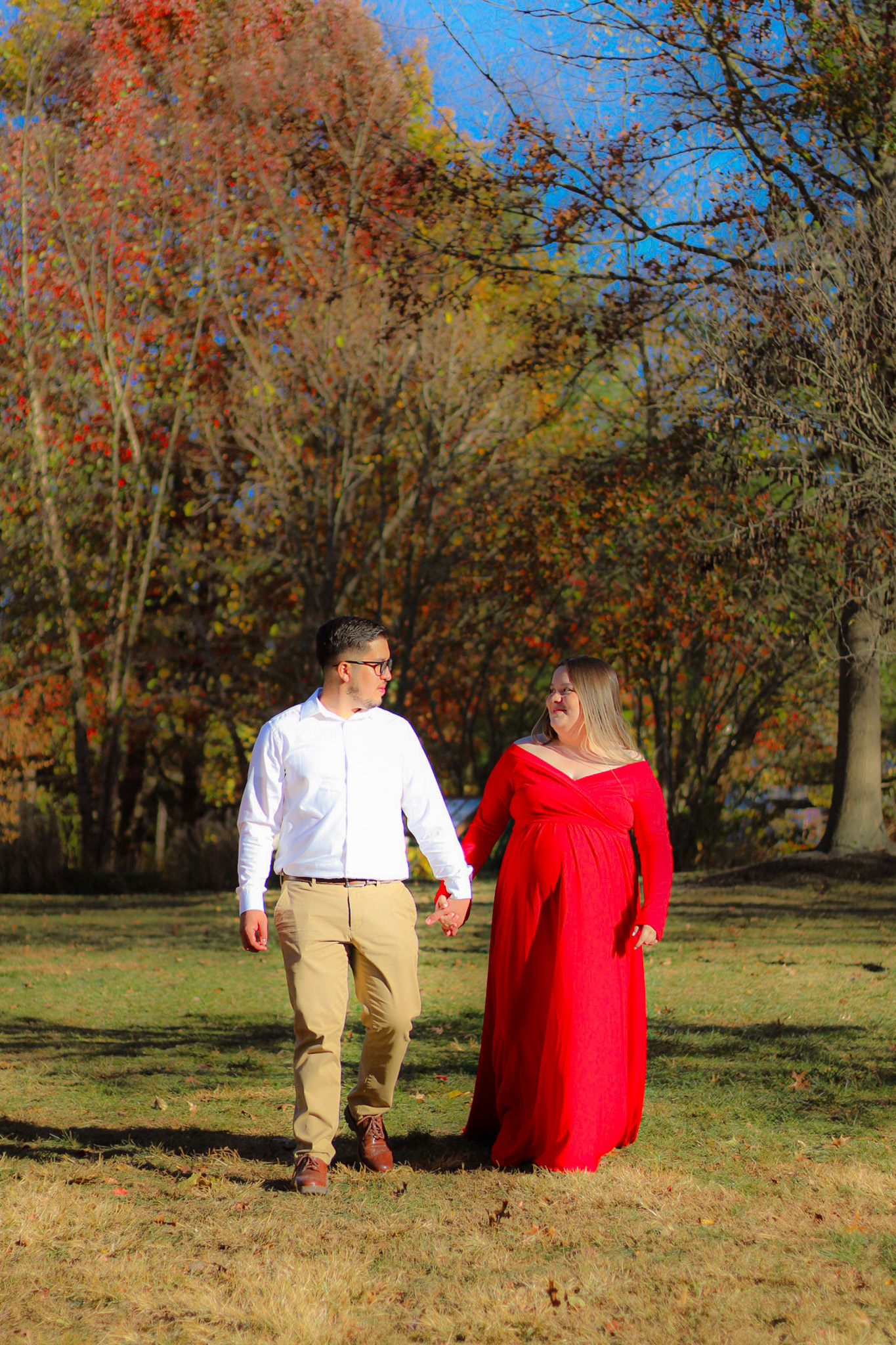 A couple photographed outdoors