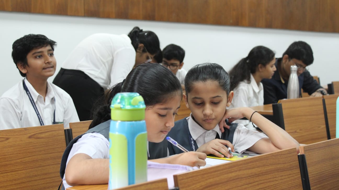 Students writing quiz paper