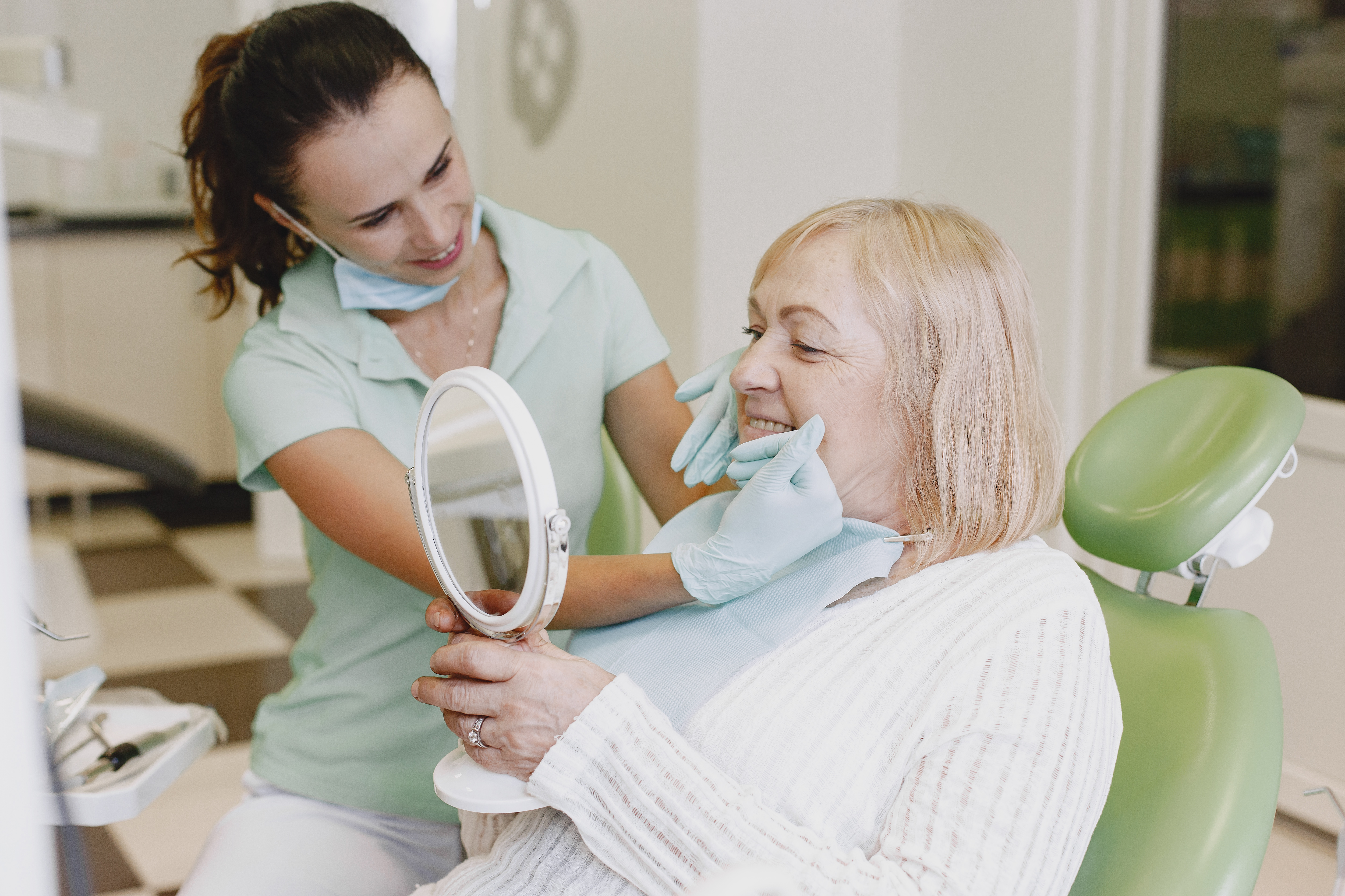 Senior Woman Dental Mirror Consultation